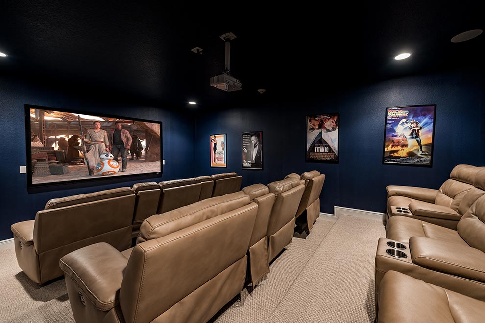 Multi-level movie theater room inside a curated Encore Resort residence.