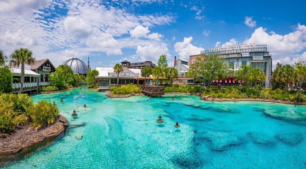 Disney Springs shopping district in Orlando, Florida, featuring an artificial lagoon designed to look like a natural Florida spring.