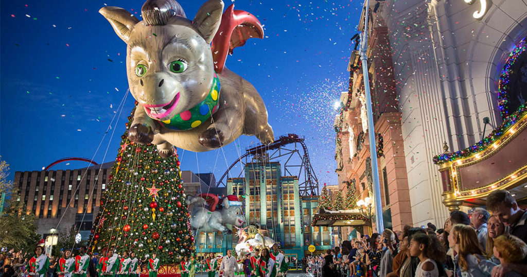 Universal Studios Florida theme park’s holiday parade featuring a large parade balloon depicting Donkey from “Shrek.”