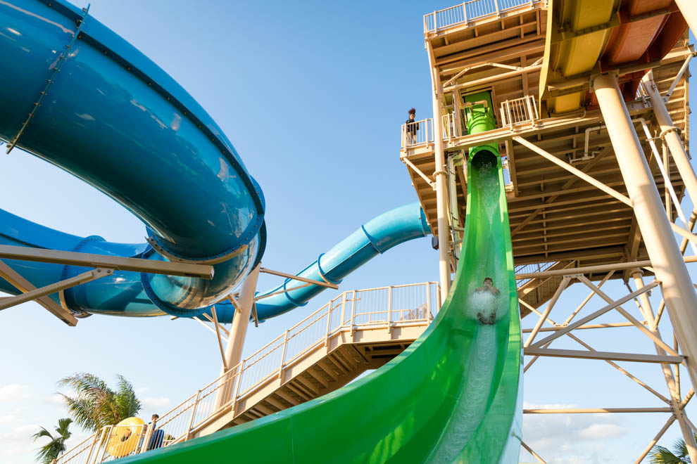 Encore Resort guest riding a slide at the Water Park.