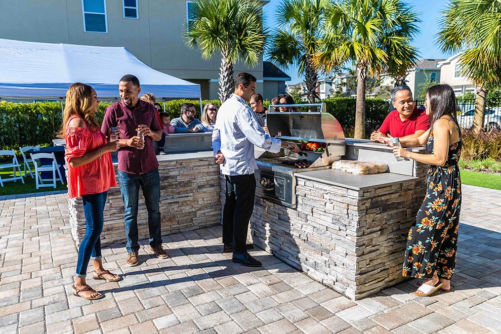 Chef cooks live for a corporate team during an outdoor team-building activity at Encore Resort.