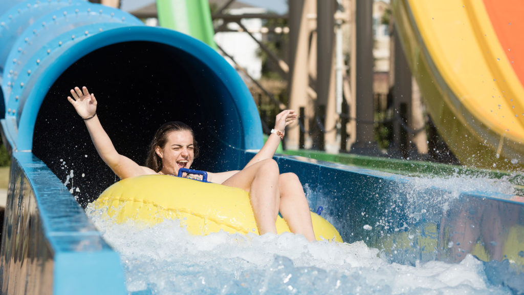 Girl rides the Tsunami water slide in a tube at the Encore Resort water park.