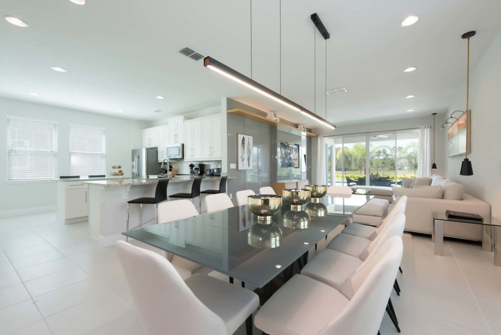 Modern, furnished dining room and kitchen inside one of Encore Resort at Reunion’s curated resort residences.