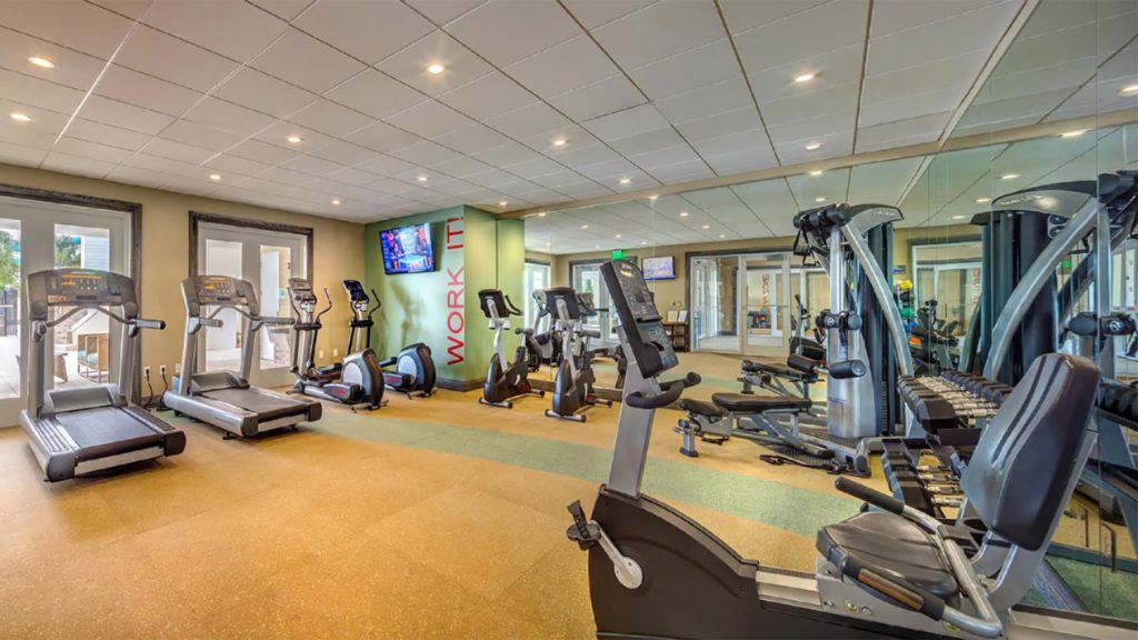 Exercise bikes, treadmills, and other fitness equipment in the Encore Resort at Reunion Clubhouse fitness room.