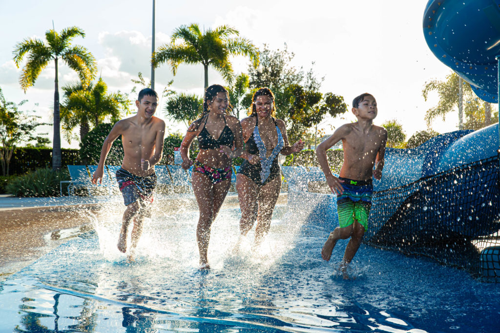 Kids and teens splashing at a water park