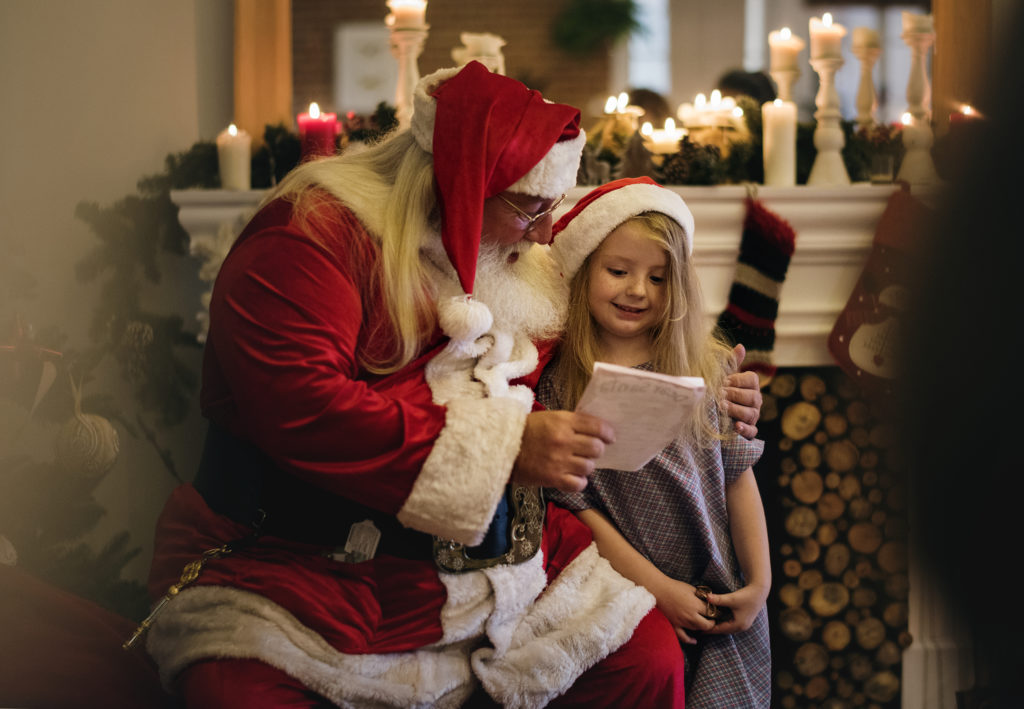 Santa Claus speaking with a child
